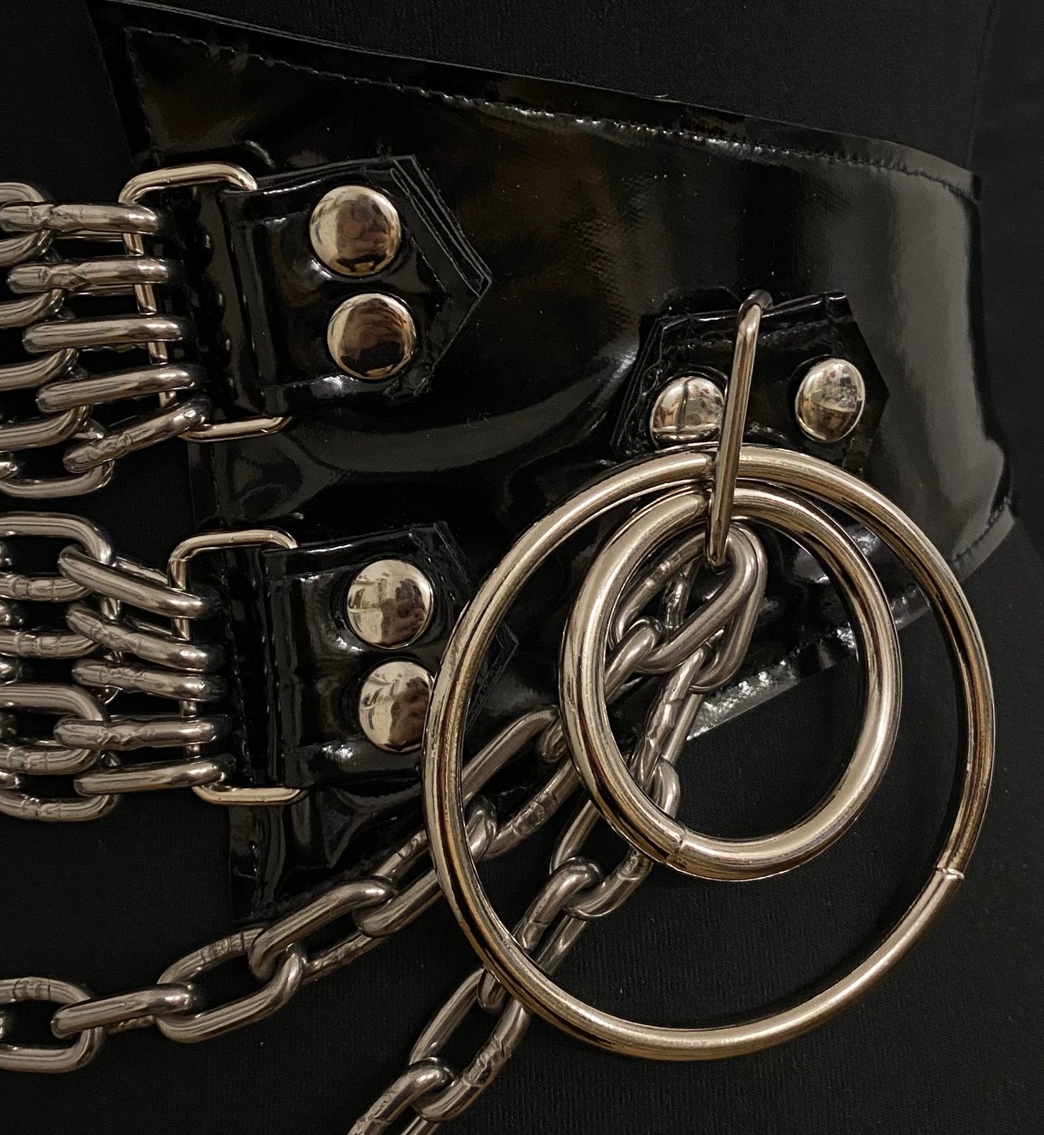 black vegan leather shiny pvc vinyl waist cincher gothic belt goth corset chains and rings black and silver harness 